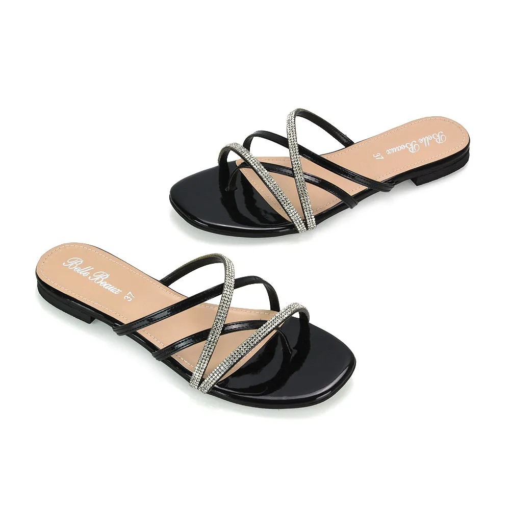 LORETTA CROSS OVER STRAPPY SLIP ON FLAT DIAMANTE SANDALS IN BLACK PATENT