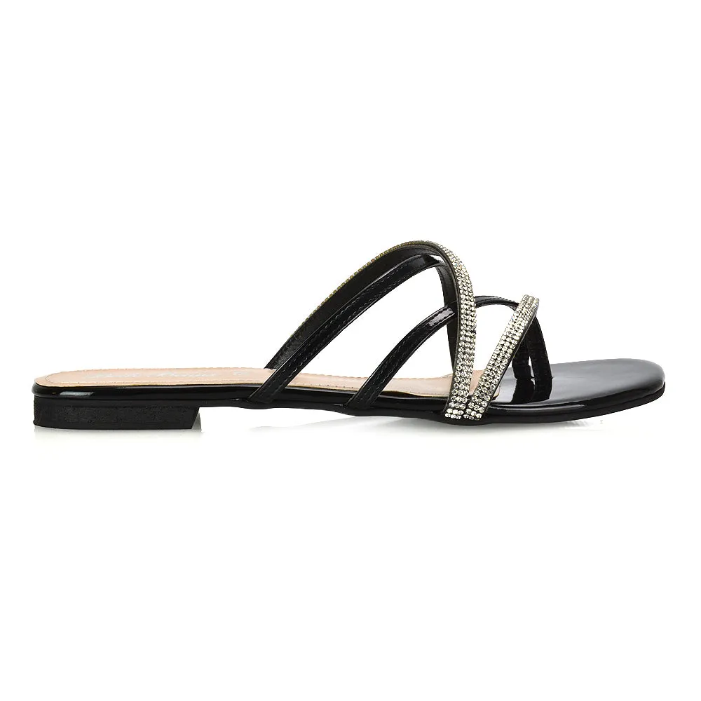 LORETTA CROSS OVER STRAPPY SLIP ON FLAT DIAMANTE SANDALS IN BLACK PATENT